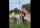 Pictured, left to right: Troop 160 Scoutmaster Kevin Smith; Scouts Kenneth Thompson, Alex Gaither, Caden Gaither, and Jasper Mercado with volunteer Travis Smith lowering the flag. photo provided