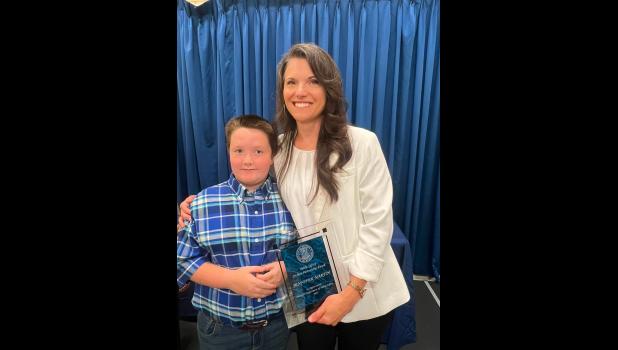 Jennifer Martin with the child she saved from a frozen pond in February. photo courtesy of Lori Foster Logan
