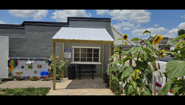 The shade shelter and parent sitting area next to the ADA-accessible sensory board. Howell County News/ Amanda Mendez