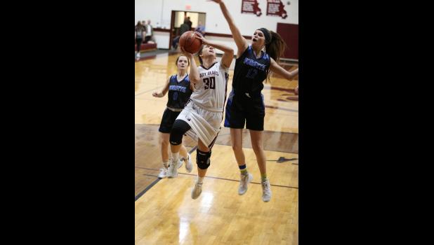 Alyssa VonAllmen going up for two as the lady Bears lose the second round of District to Forsyth. courtesy photo/ Shawana Cox