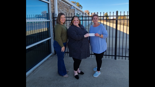 The Chaos Closet Board Member Erin Swift and Director DeeDee Button are pictured above with 37th Circuit Children's Division Manager Shawn Bentley. photo provided