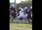 The Willow Springs Bears traveled to Ash Grove to take on the Pirates for the first game of the season on Friday, Aug. 28. Senior Elijah Roberts tries to take down the Pirates quarterback. The Bears fell to the Pirates 22-24. courtesy of Shawana Cox